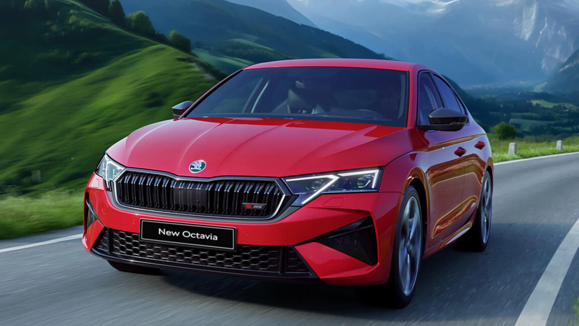 A red car driving on a road
Description automatically generated