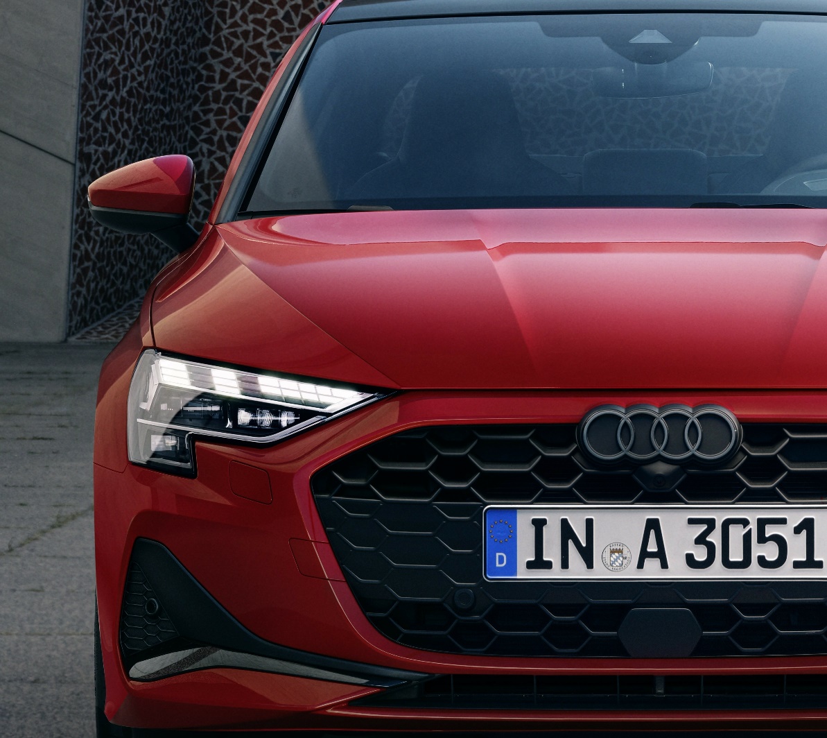 The front of a red car

Description automatically generated